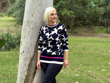 Wrap yourself in luxury with our Wear Colour Shadow Floral Pullover. This stylish and fashionable piece is both soft and eye-catching, with a mix of navy and natural tones highlighted by hot pink accents. Made from a blend of viscose and nylon, it's the perfect choice for a fun and playful look this autumn/winter.