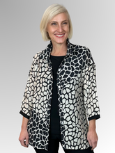 Experience effortless style with the Splice 3/4 Sleeve Overshirt by Renoma. Featuring a striking black and ivory spliced design, this lightweight overshirt combines viscose and nylon for a soft, floaty feel. The wired collar lets you shape it to your preference, adding a personalised touch to your look. Perfect for layering, it offers both comfort and a bold statement in one versatile piece.