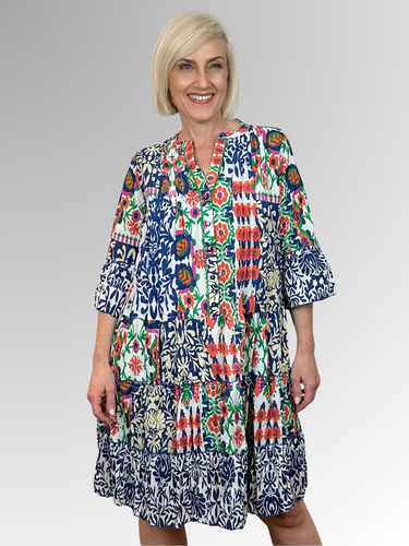 Discover effortless summer style with the Buzios 3/4 Sleeve Frill Dress by Orientique. This delightful design features an A-line silhouette, charming ruffled tiers and relaxed 3/4 length frill sleeves for that perfect carefree vibe. The mandarin collar brings a touch of flair, while the comfortable fit keeps you feeling fabulous all day long. Made from 100% organic cotton, it's soft, breathable and perfect for lazy afternoons or casual outings.