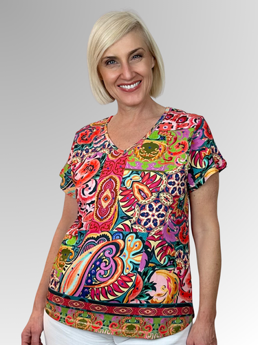 Transport yourself to exotic destinations with every wear in the charming Francesca V-Neck Tee from Escape by Orientique. Adorned with eye-catching prints that spark adventure, this laid-back essential delivers comfort without compromise. The flattering V-neckline and breezy short sleeves create an effortlessly chic silhouette, while the relaxed fit ensures you can move freely whether you're exploring new horizons or dreaming of them. Crafted from a breathable cotton, rayon, and spandex blend that feels as 