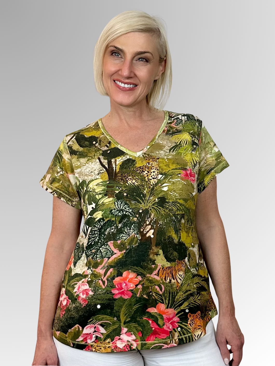Transport yourself to exotic destinations with every wear in the charming Cecilia V-Neck Tee from Escape by Orientique. Adorned with eye-catching prints that spark adventure, this laid-back essential delivers comfort without compromise. The flattering V-neckline and breezy short sleeves create an effortlessly chic silhouette, while the relaxed fit ensures you can move freely whether you're exploring new horizons or dreaming of them. Crafted from a breathable cotton, rayon, and spandex blend that feels as go