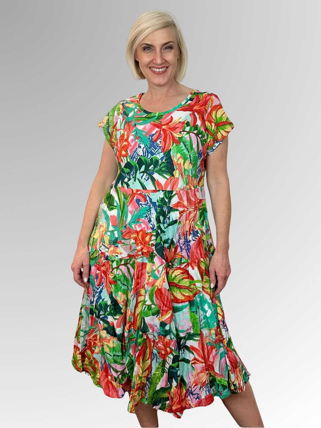 Escape the heat in style with the Equador Crinkle Layered Pocket Dress by Orientique. This breezy number features a round neckline, short sleeves, and practical pockets to keep your essentials close. The eye-catching multi-coloured print brings instant personality to any warm-weather occasion, while the lightweight crinkle fabric keeps you cool and comfortable. Whether you're exploring a new destination or simply enjoying a leisurely afternoon, this dress delivers effortless charm. Crafted from 100% organic