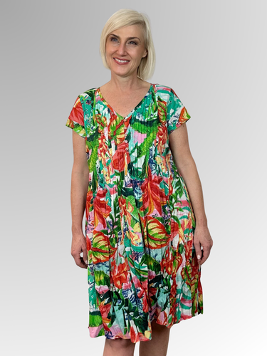 Stay cool and comfortable in the Equador Easy Fit Dress by Orientique. Made from organic crinkled cotton, this dress is lightweight and perfect for those hot summer days. The relaxed fit, V-neckline with button trim and pleat detailing add a touch of style, while the pockets make it practical for everyday wear. Ideal for lounging in the heat!