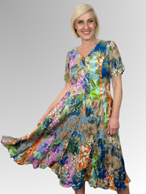 Introducing the Miramar Godet Dress by Orientique! Made from soft, sustainable rayon, this dress features a hand painted floral print in a gorgeous array of colours. The crinkle fabric is oh-so-comfy with no ironing required. Featuring short sleeves, a flattering V-neckline and godet panels through the skirt that create a beautiful drape and swing.&nbsp;Perfect for summer, this cool and flowy dress is a must-have addition to your wardrobe.