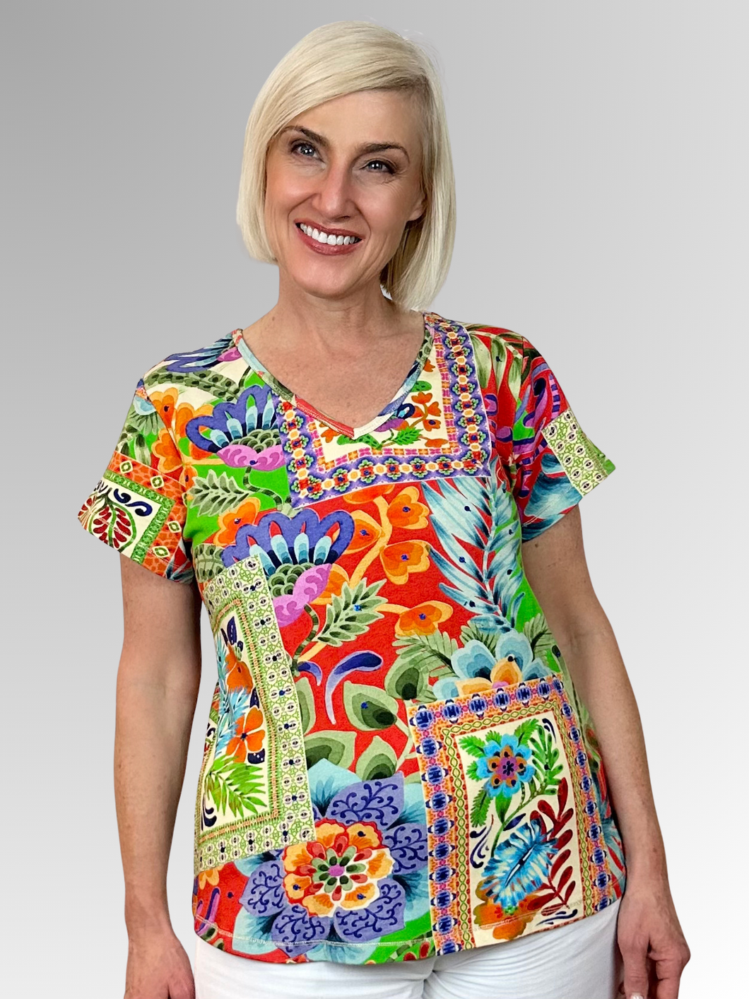 Transport yourself to exotic destinations with every wear in the charming Sofia V-Neck Tee from Escape by Orientique. Adorned with eye-catching prints that spark adventure, this laid-back essential delivers comfort without compromise. The flattering V-neckline and breezy short sleeves create an effortlessly chic silhouette, while the relaxed fit ensures you can move freely whether you're exploring new horizons or dreaming of them. Crafted from a breathable cotton, rayon, and spandex blend that feels as good