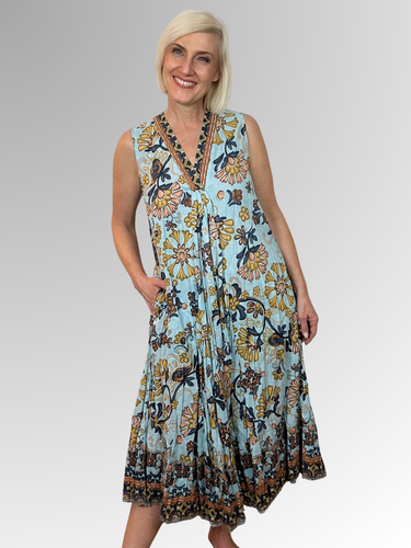 Slip into the Macieo V-Neck Sleeveless Dress and embrace effortless summer style. Crafted from 100% organic cotton with a relaxed, flowing silhouette, this lightweight number keeps you feeling cool all day long. The flattering V-neckline and sleeveless cut offer comfort, while practical pockets add everyday functionality. Vibrant colours and prints bring personality to your wardrobe, making it the go-to choice for beach days, tropical escapes, and casual outings. Easy-care crinkled fabric means less fussing