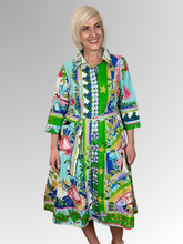 The Sante Fe Collared Tie Dress is your summer staple. This stylish knee-length dress features a classic collar, button-through front, and a tie waist belt that flatters your figure. Made from 100% organic cotton with 3/4 length sleeves, it's perfect for casual outings or special occasions.