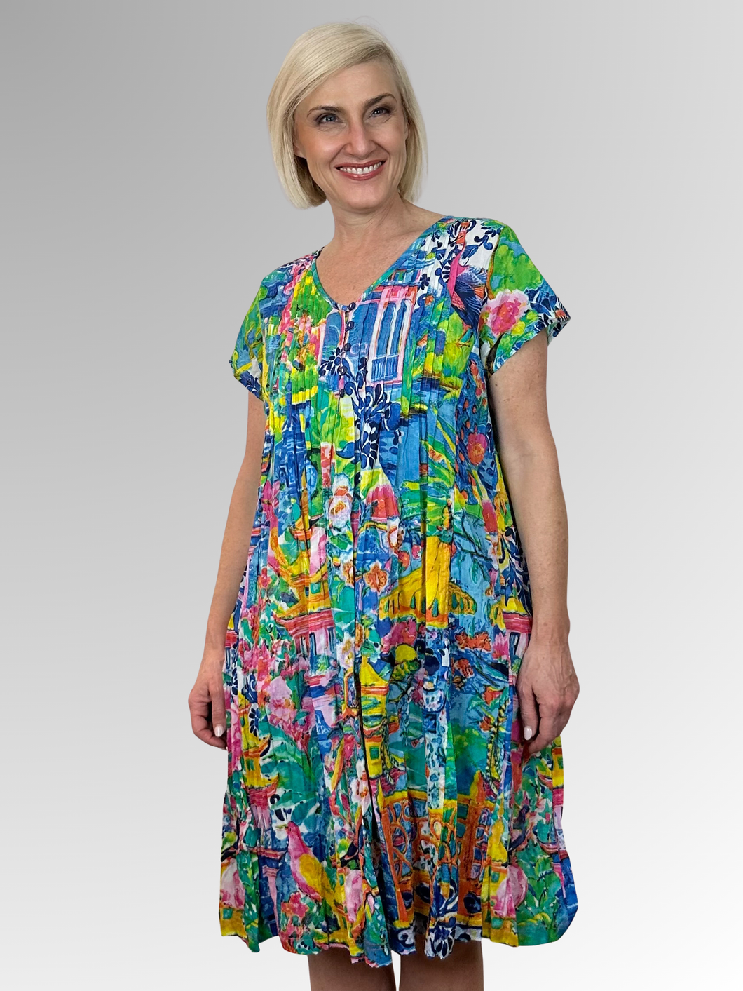 Stay cool and comfortable in the Okayama Easy Fit Dress by Orientique. Made from organic crinkled cotton, this dress is lightweight and perfect for those hot summer days. The relaxed fit, V-neckline with button trim and pleat detailing add a touch of style, while the pockets make it practical for everyday wear. Ideal for lounging in the heat!