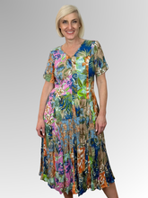 Introducing the Miramar Godet Dress by Orientique! Made from soft, sustainable rayon, this dress features a hand painted floral print in a gorgeous array of colours. The crinkle fabric is oh-so-comfy with no ironing required. Featuring short sleeves, a flattering V-neckline and godet panels through the skirt that create a beautiful drape and swing.&nbsp;Perfect for summer, this cool and flowy dress is a must-have addition to your wardrobe.