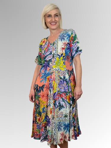 Introducing the Aruba Godet Dress by Orientique! Made from soft, sustainable rayon, this dress features a hand painted tropical print in a gorgeous array of colours. The crinkle fabric is oh-so-comfy with no ironing required. Featuring short sleeves, a flattering V-neckline and godet panels through the skirt that create a beautiful drape and swing; Perfect for summer, this cool and flowy dress is a must-have addition to your wardrobe.