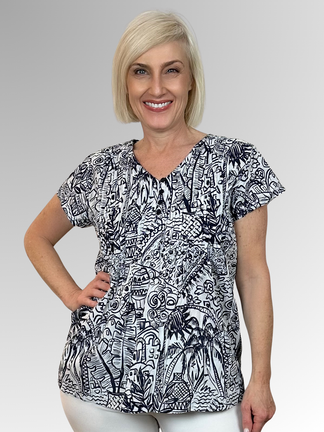 Beat the heat in style with the gorgeous Aksharay Navy Pleat Top from Orientique! Made from soft organic cotton, this charming piece features a buttoned V-neckline, pleating across the bust and back, and cap sleeves that frame the shoulders perfectly. It's the ultimate combo of comfort and fashion that'll keep you looking fabulous all summer long.