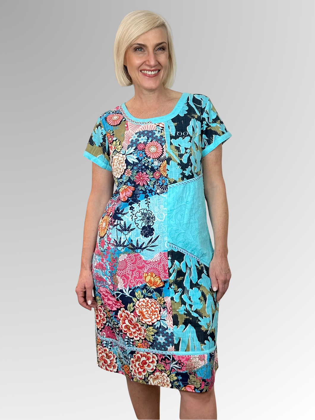 Elevate your warm-weather wardrobe with the Ikebana Patch Dress by Orientique; a breezy essential crafted from Certified Organic Cotton. Featuring an eye-catching floral print and distinctive neckline stitching, this lightweight piece keeps you cool while turning heads. Perfect for lazy days in the sun or casual outings, it's the effortless style upgrade your summer deserves!