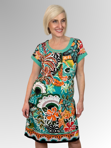 Elevate your warm-weather wardrobe with the Guaratiba Patch Dress by Orientique; a breezy essential crafted from Certified Organic Cotton. Featuring an eye-catching tropical print and distinctive neckline stitching, this lightweight piece keeps you cool while turning heads. Perfect for lazy days in the sun or casual outings, it's the effortless style upgrade your summer deserves!